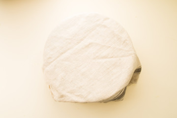 Step by step recipe to prepare a tasty challah, ingredients list  500 grams of baking wheat on a big  porcela jar, top view over a yellow background, check the ther image of the series.