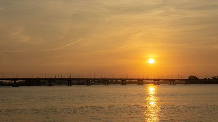 sunset over a bridge