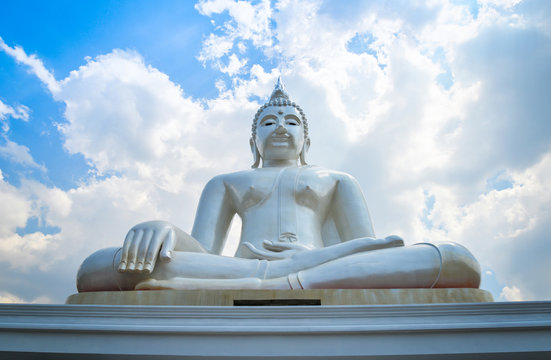 Beautiful white buddha statue on nature cloud sky background