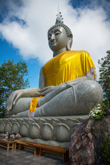Beautiful big buddha statue sitting and blue sky background
