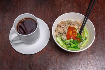 healthy organic chicken noodles with vegetables and a cup of tea