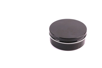 Black cosmetic containers on white background
