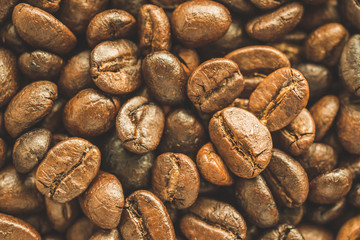 Roasted coffee beans closeup texture background