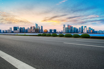 Foreground highway asphalt pavement city building commercial building office building