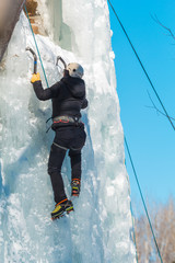 Woman Ice Climbing