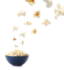 Bowl with delicious fresh popcorn on white background