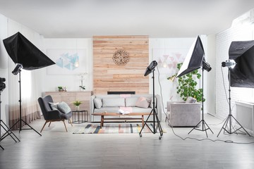 Professional photo studio equipment prepared for shooting living room interior