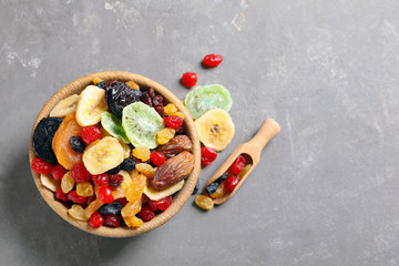 Fototapeta na wymiar Flat lay composition with different dried fruits on grey background, space for text. Healthy lifestyle