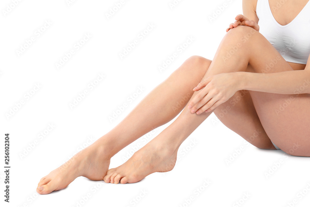 Sticker Young woman with perfect smooth skin on white background, closeup of legs. Beauty and body care