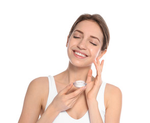 Portrait of young woman with jar of cream on white background. Beauty and body care