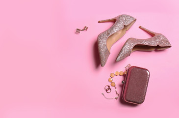 Flat lay composition with lady's shoes on color background. Space for text