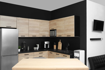 Cozy modern kitchen interior with new furniture and appliances