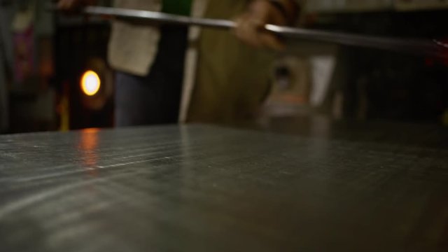 Shaping glass on a stainless table