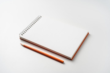 perspective view of spiral orange notebook