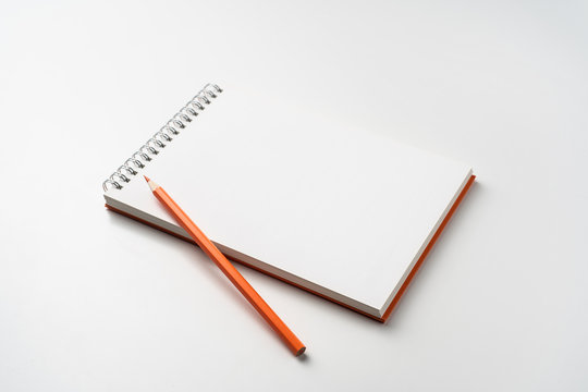 perspective view of spiral orange notebook