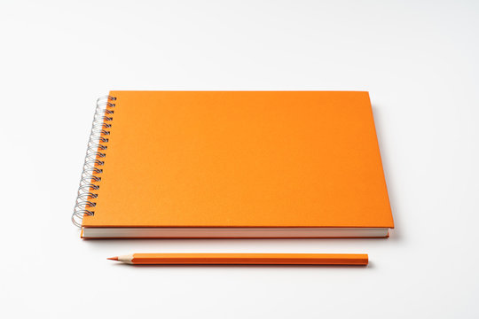 perspective view of spiral orange notebook