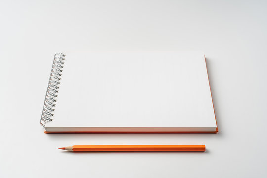 perspective view of spiral orange notebook