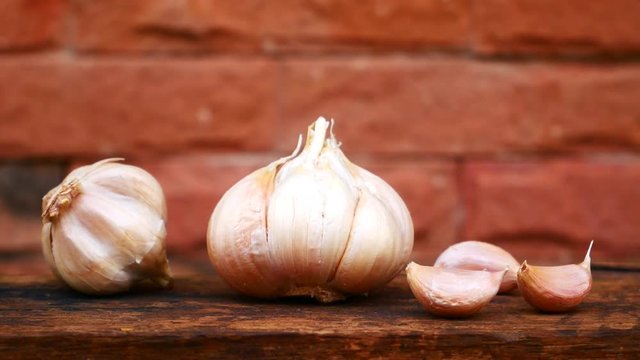garlic and onion on wooden board