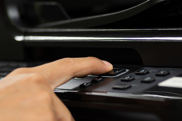 Hand male using printer.