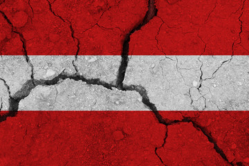 austria flag on the cracked earth