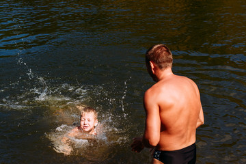 six-year-old child learns to swim