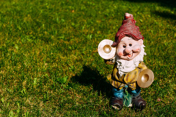 figurine of a dwarf on the grass