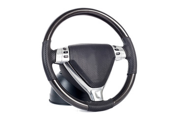 Close-up black-silver handmade Multifunction wheel made of genuine leather with phone control buttons and other settings on a white isolated background, front view.
