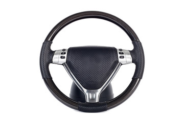 Close-up black-silver handmade Multifunction wheel made of genuine leather with phone control buttons and other settings on a white isolated background, front view.