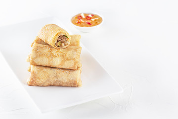 Chinese tortillas - bings in plate on a white background. Copy space