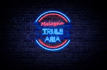 A red and blue neon light sign that reads: Malaysia Truly Asia