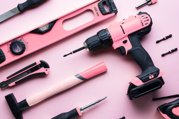 Creative provocation: a flat layout of pink hand tools on a pink background.