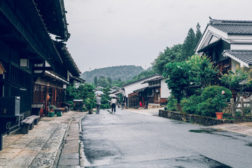 Kiso valley is the old  town or Japanese traditional wooden houses for the travelers walking at historic old street  in Narai-juku , Nagano Prefecture, JAPAN.