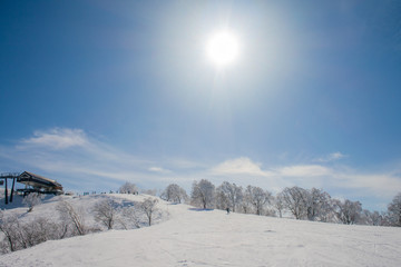Landscape and Mountain view of Nozawa Onsen in winter with sunrise background.  , Nagano, Japan.