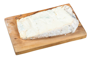 Gorgonzola soft blue cheese on board isolated