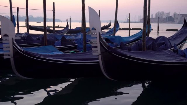 Gondolas in Venice in the moning. On background San Giorgio Maggiore island is visible