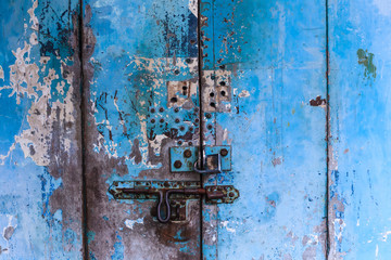vintage retro wooden door and slide lock. Home interior architectural design, plain tropical blue painted texture wood panel board door wall in old traditional Asian house, Wallpaper, backdrop concept