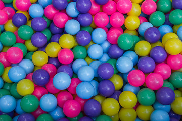 Fototapeta na wymiar Many colorful plastic balls