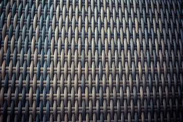 Synthetic rattan texture weaving background as used on outdoor garden furniture.