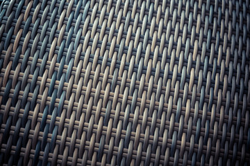 Synthetic rattan texture weaving background as used on outdoor garden furniture.