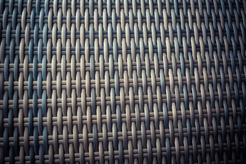 Synthetic rattan texture weaving background as used on outdoor garden furniture.