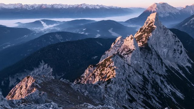 Sunrise illuminating​ mountain ridge