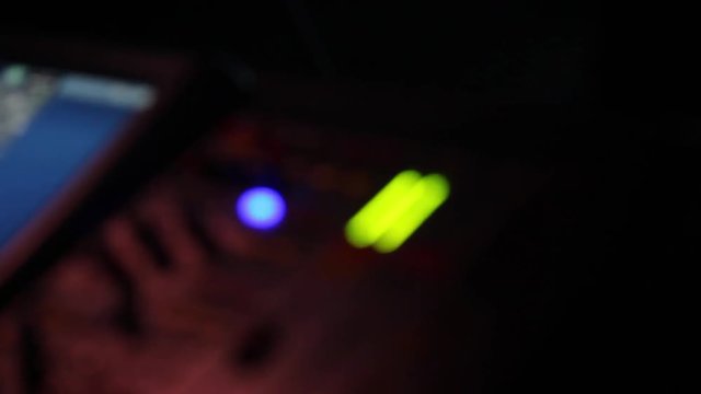 remote recordists closeup. Hand adjusts sound effects. Electric machine on table for working of sound designer or club dj at party in nightclub. Occupation for modern lifestyle, objects for listen at 