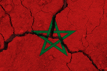 Morocco flag on the cracked earth