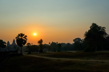 Fototapeta na wymiar Sunrise view of popular tourist attraction ancient temple complex Angkor Wat Siem Reap, Cambodia