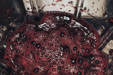 Fresh juice grapes in blender. Close up.