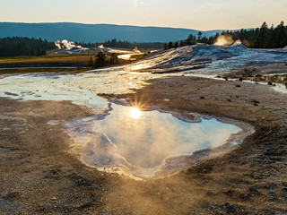 Reflection of the sun in the hot springs