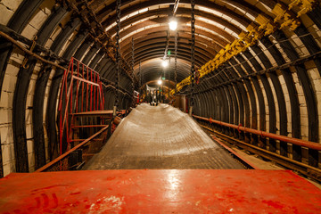 Empty conveyor belt in underground coal mine. Crisis in the mining industry