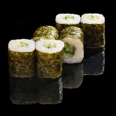 Japanese rolls, sushi on a black background