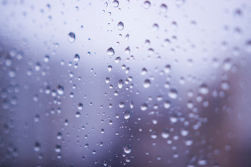 Raindrops on the glass window blur