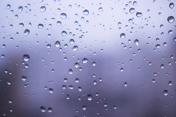 Raindrops on the glass window blur